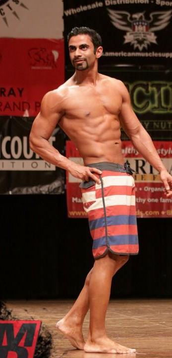 Prithvi Kalidindi competing on the NPC Men's Physique stage, 2015